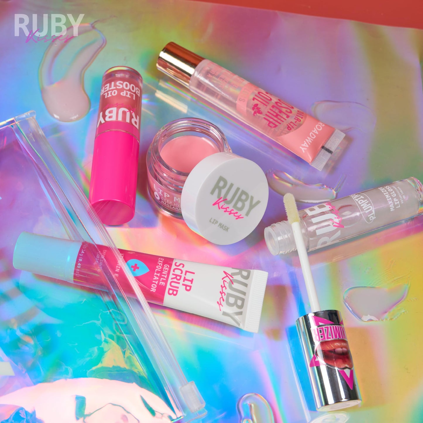 Ruby Kisses Value Lip Care Travel Kit With Rosehip Oil Clear Lip Gloss, High Shine Plumping Gloss, Pink Lip Oil Booster, Exfoliating Lip Scrub, Hydrating Intensive Lip Mask + Holographic Makeup Bag
